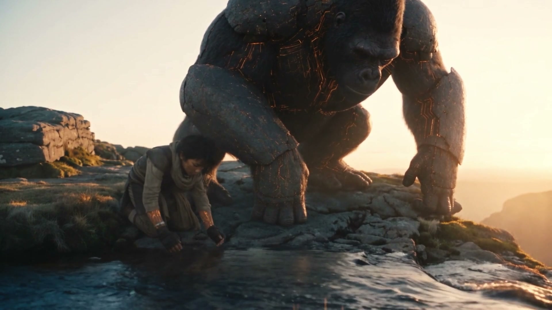 Child and glowing ape rest by a cliffside pool at sunset